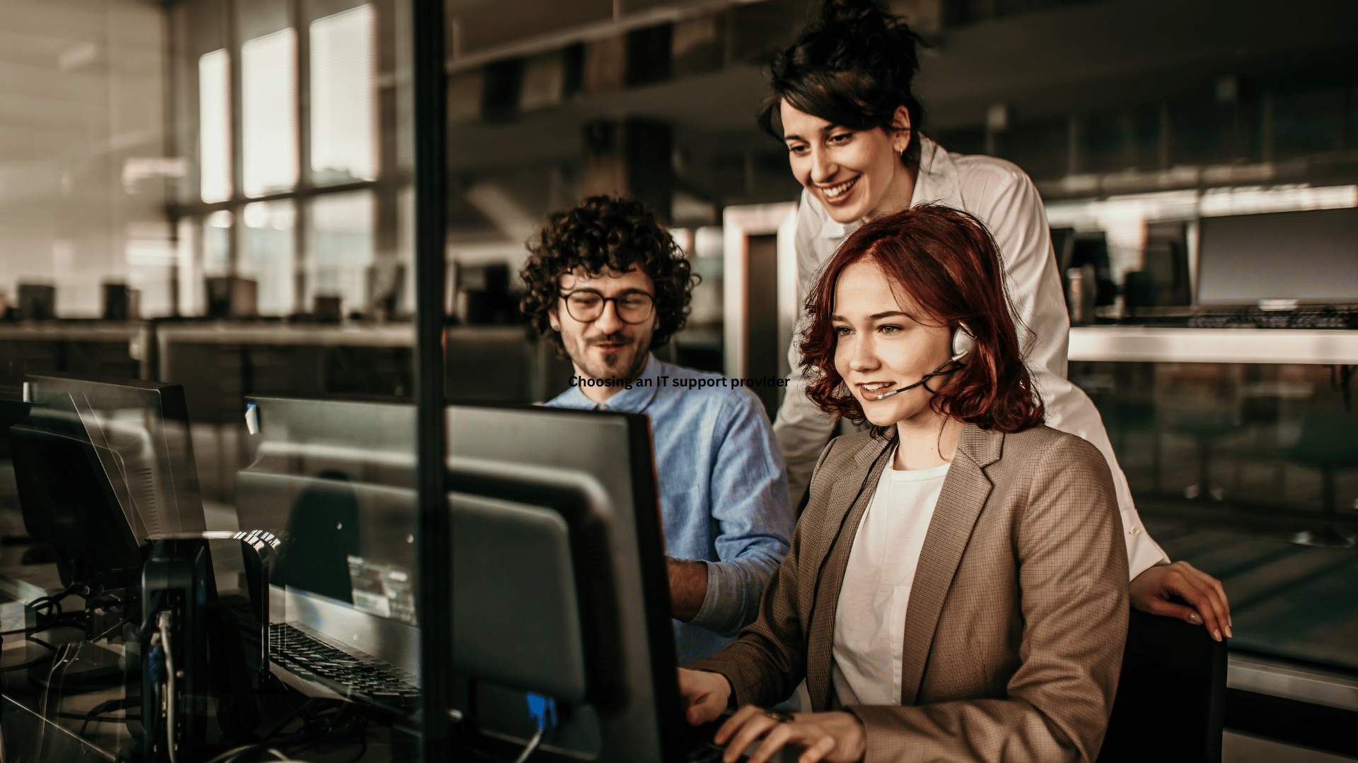 a group of people working on a computer